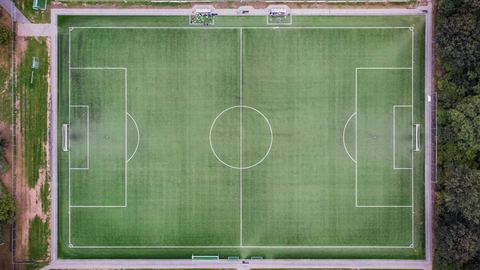 An evening stadium seen from the stands